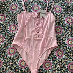 Baby pink lace up body suit